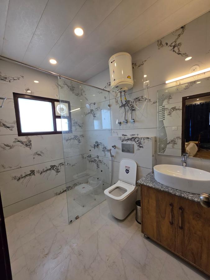 Marble bathroom with rain shower and water heater